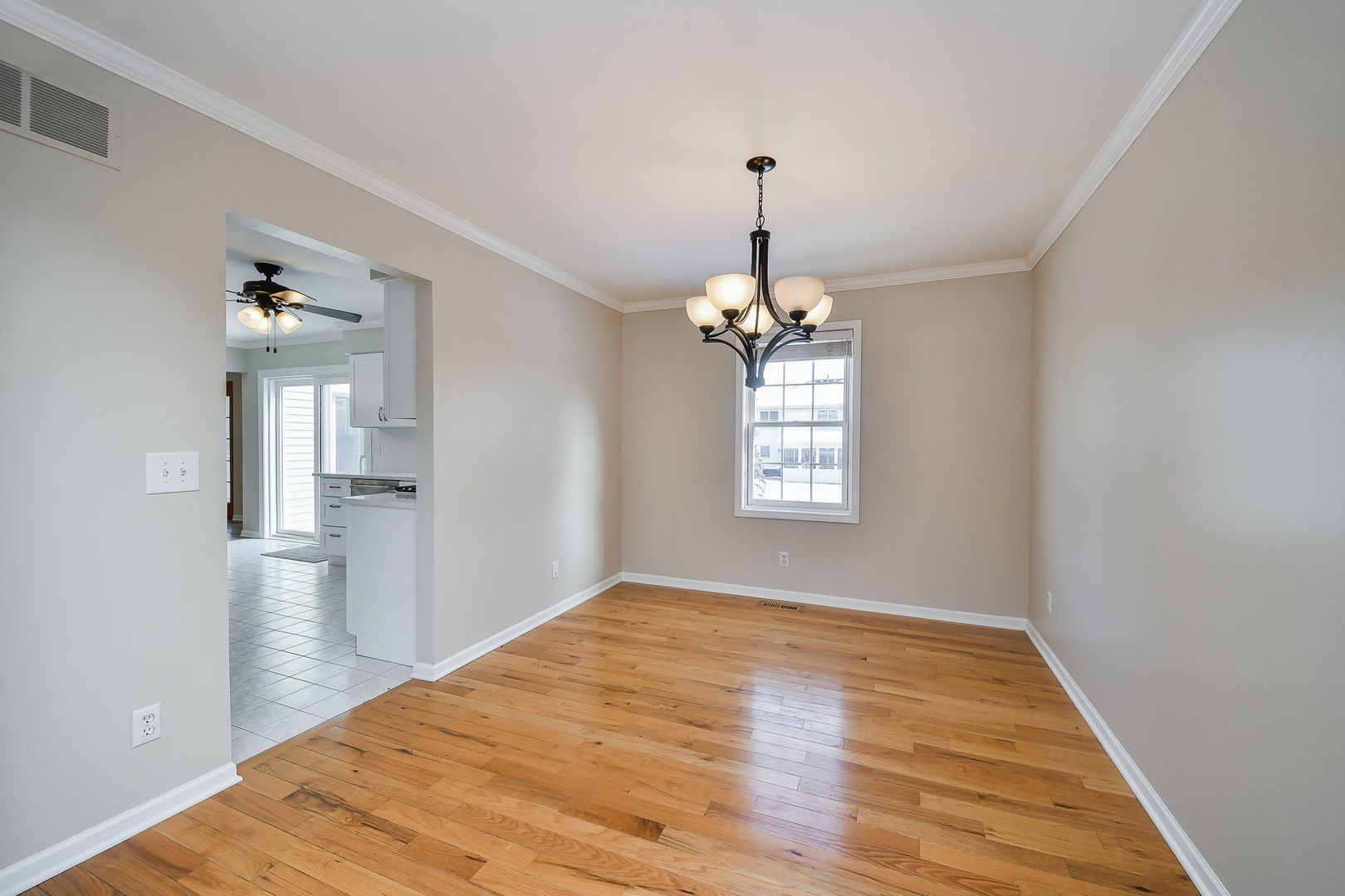 389 Colonial Circle Geneva, IL 60134 - Photo 4 of 25 a view of empty room with wooden floor