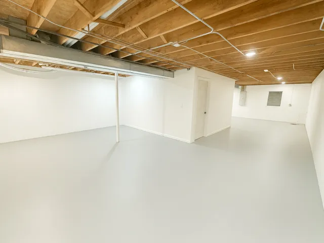 a view of a empty room with a garage
