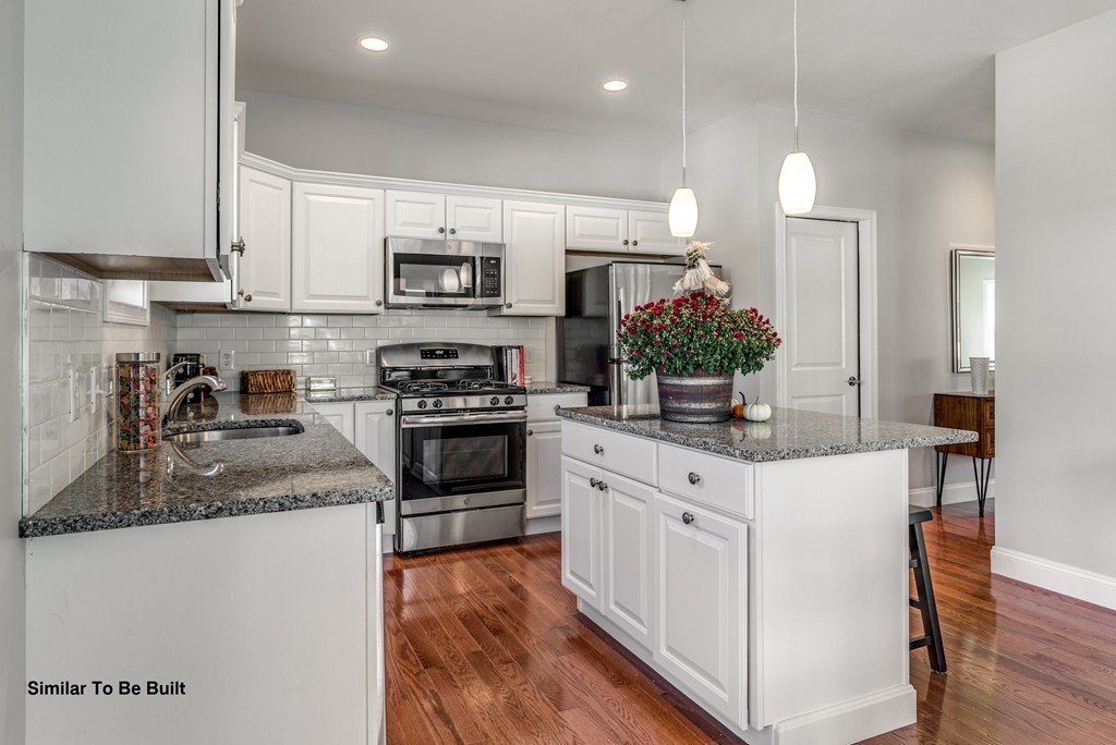 29 Eagle Nest Road, Unit 3 Long Valley, NJ 07853 - Photo 13 of 28 a kitchen with stainless steel appliances white cabinets a sink and a stove