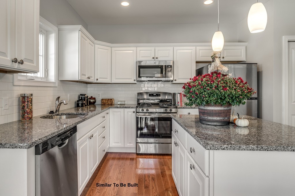 29 Eagle Nest Road, Unit 3 Long Valley, NJ 07853 - Photo 14 of 28 a kitchen with stainless steel appliances granite countertop a sink dishwasher a stove and a kitchen island