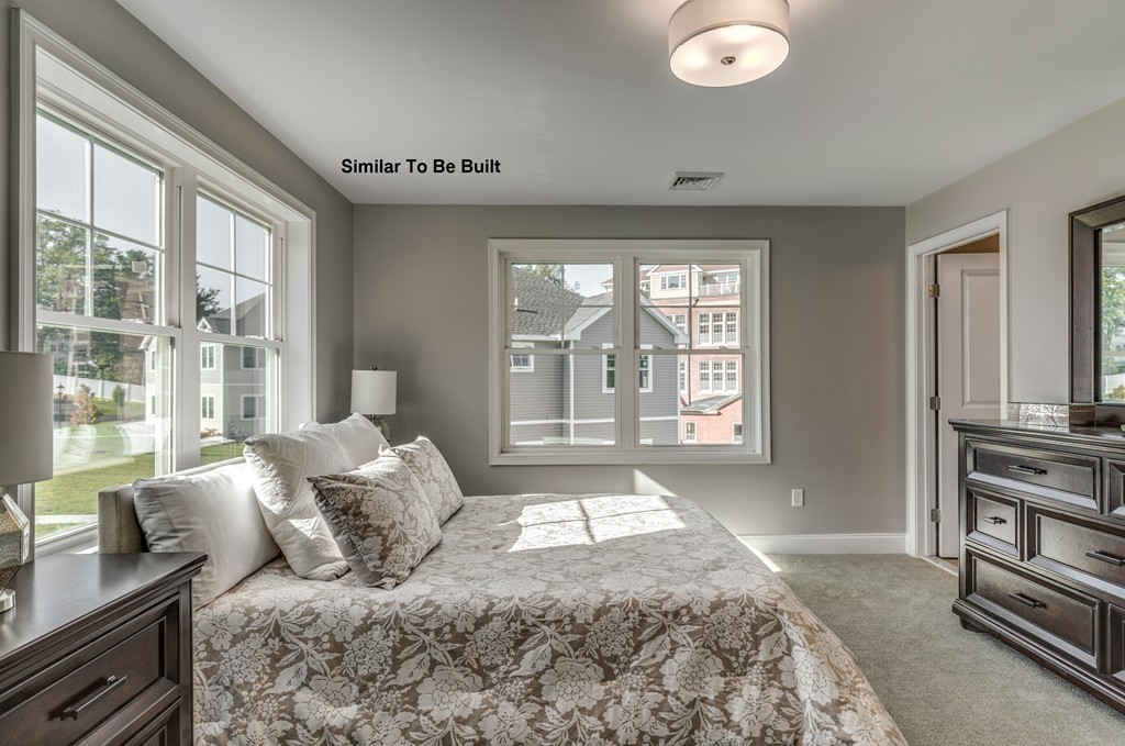 29 Eagle Nest Road, Unit 3 Long Valley, NJ 07853 - Photo 19 of 28 a bedroom with a large bed and two windows