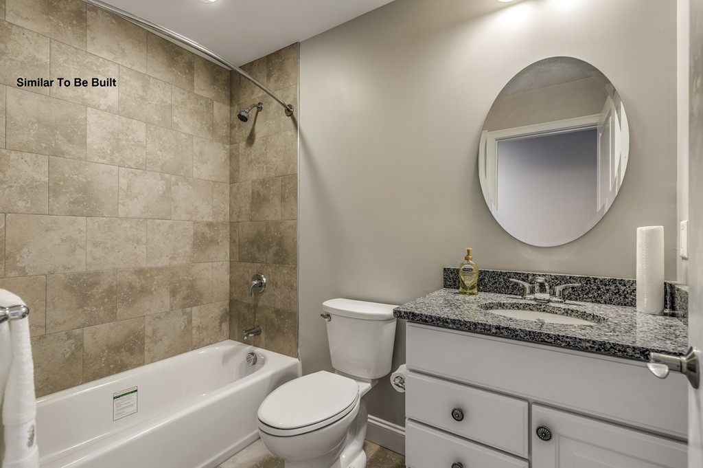 29 Eagle Nest Road, Unit 3 Long Valley, NJ 07853 - Photo 21 of 28 a bathroom with a granite countertop sink toilet mirror vanity and bathtub