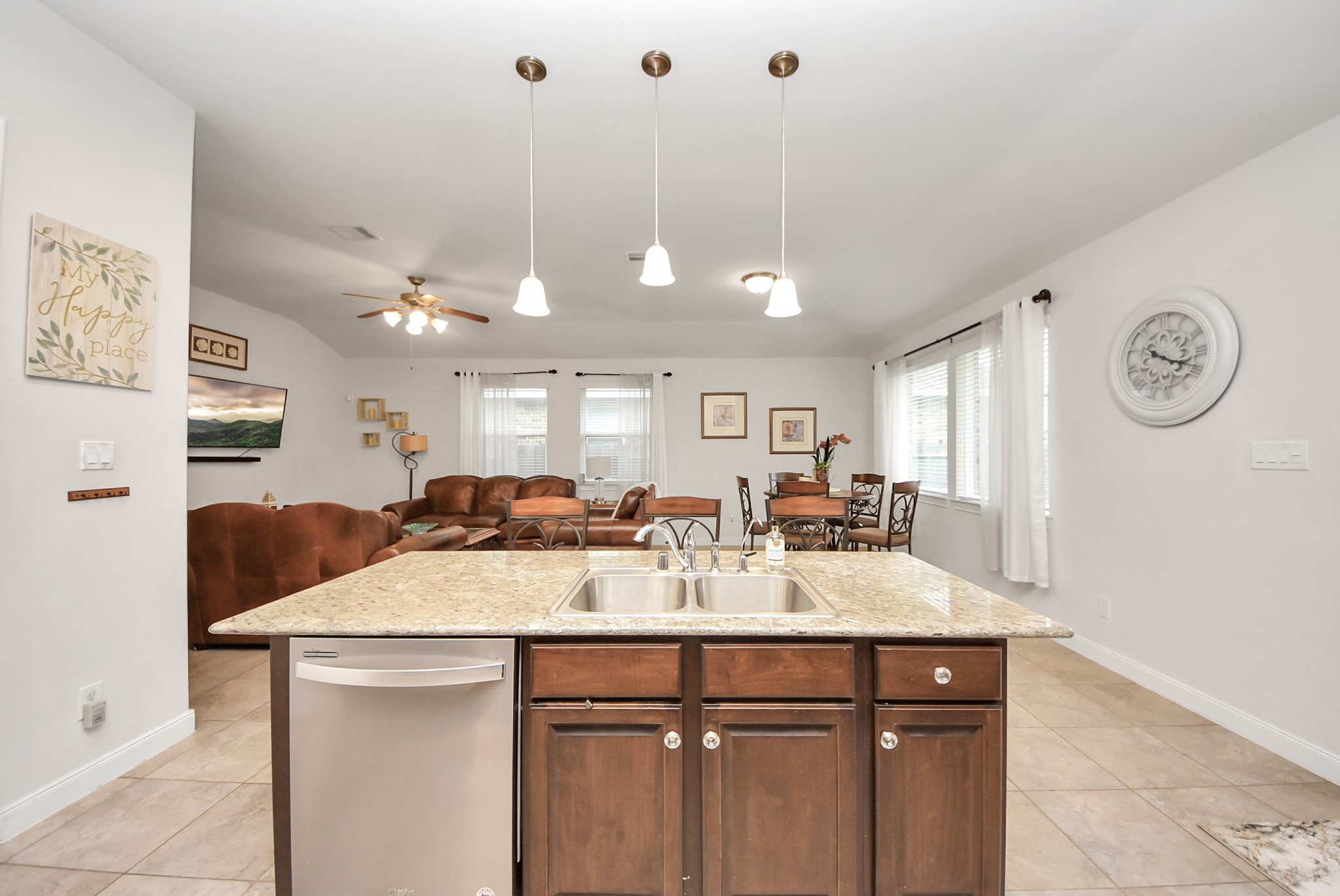 8806 Chapada Highlands Drive Cypress, TX 77433 - Photo 11 of 42 a kitchen with a sink a counter space and stainless steel appliances