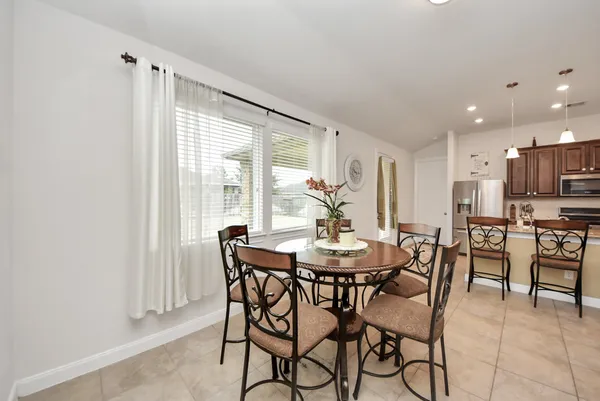 a view of a dining room with furniture window and outside view