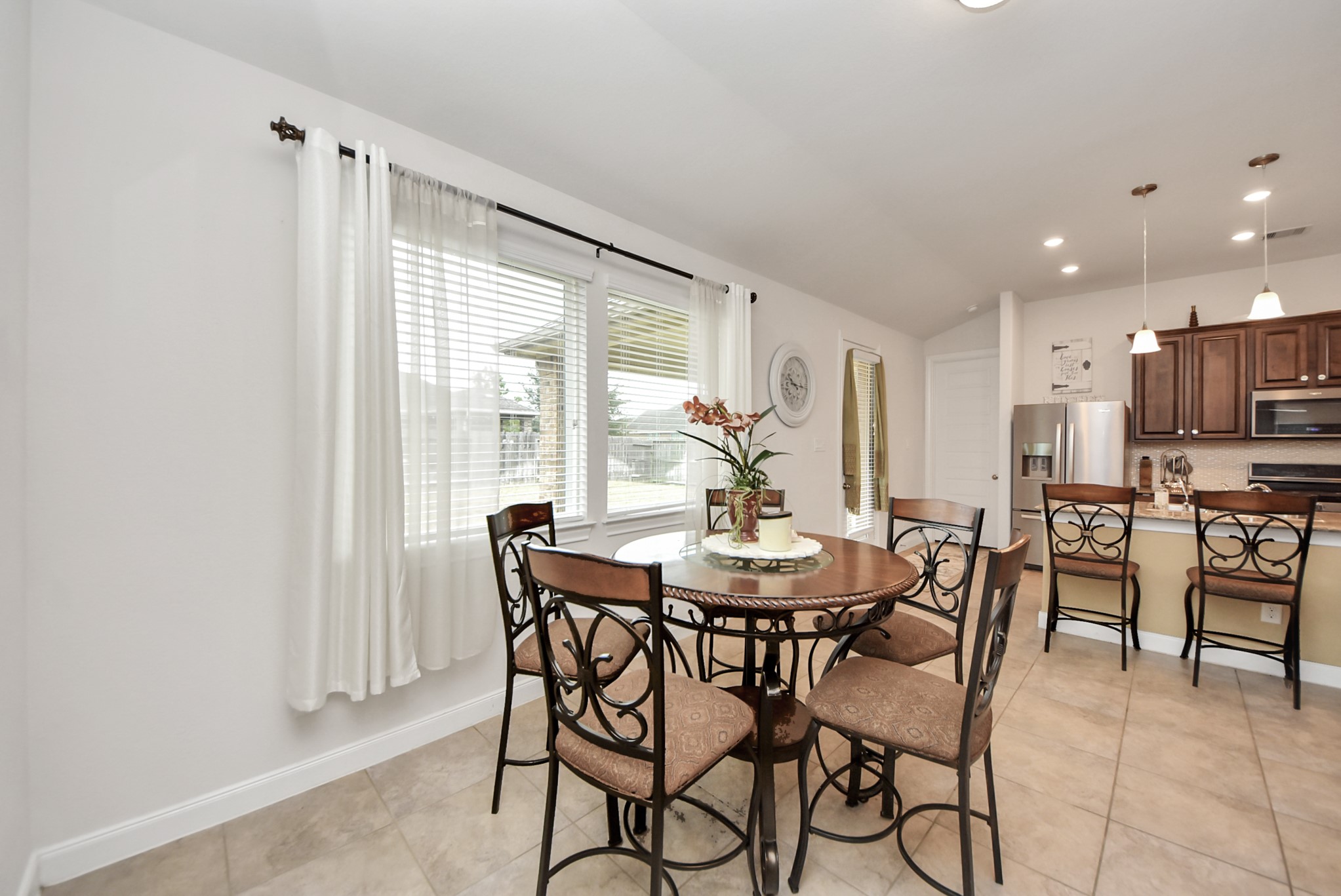 8806 Chapada Highlands Drive Cypress, TX 77433 - Photo 17 of 42 a view of a dining room with furniture window and outside view