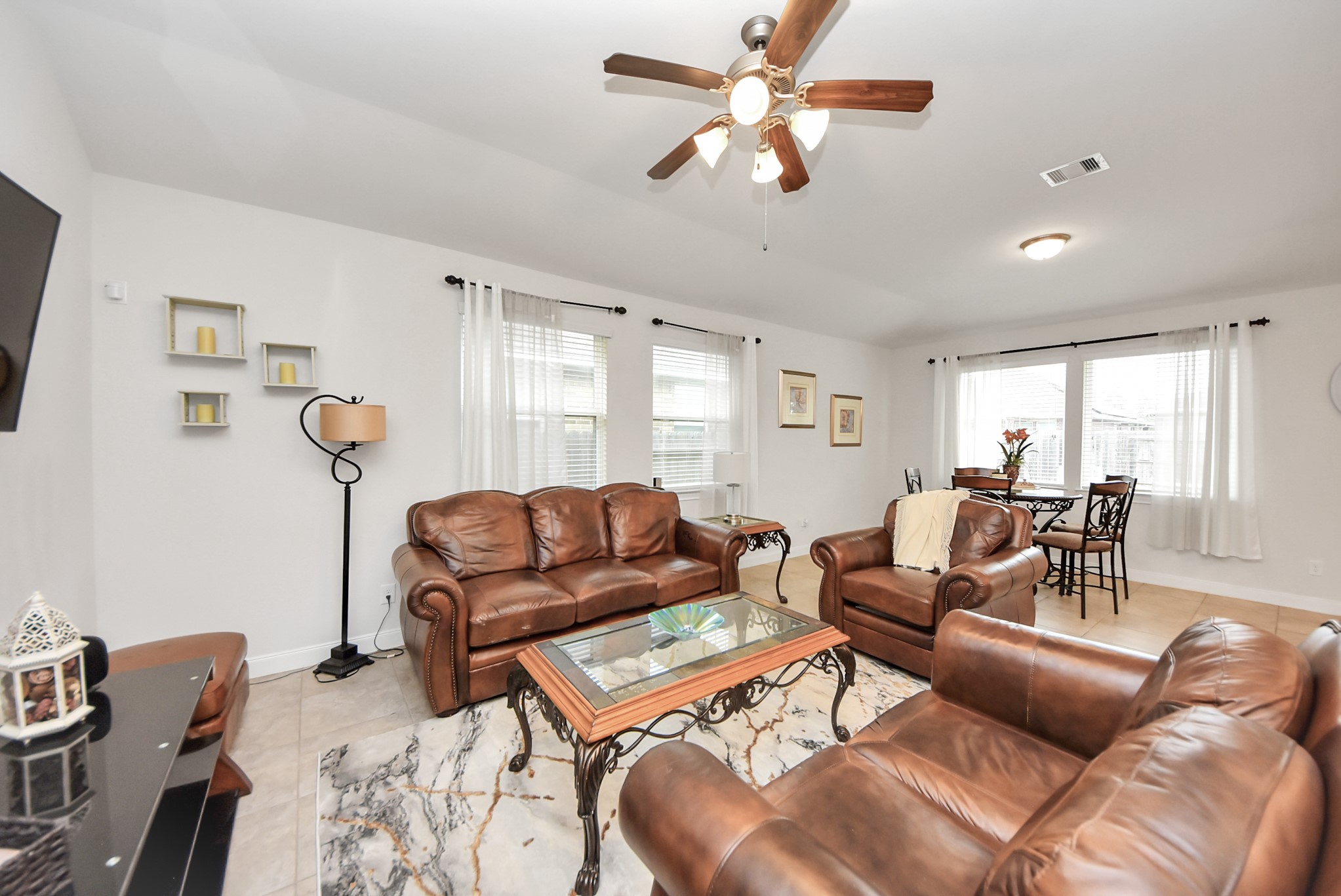 8806 Chapada Highlands Drive Cypress, TX 77433 - Photo 20 of 42 a living room with furniture and a large window