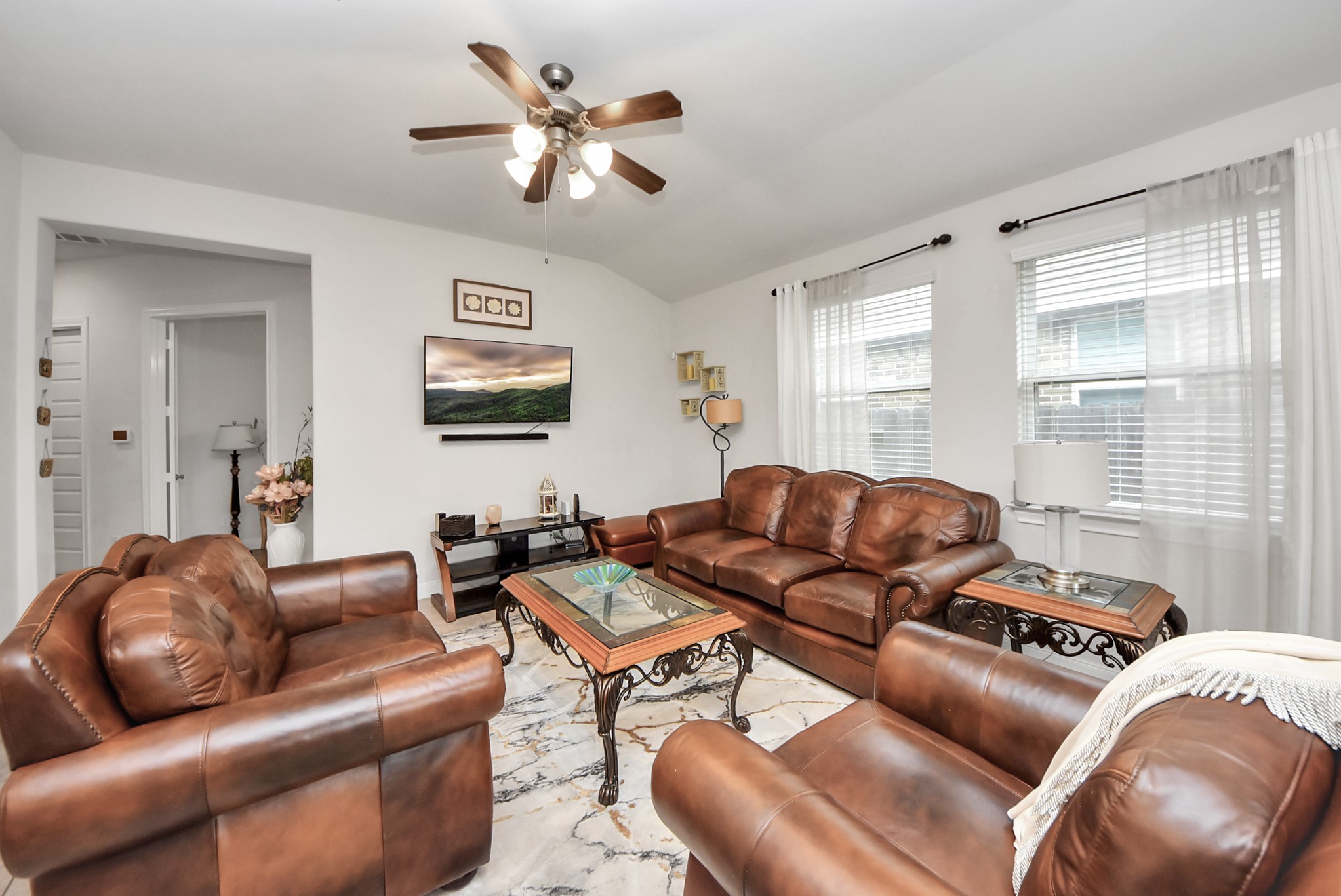 8806 Chapada Highlands Drive Cypress, TX 77433 - Photo 21 of 42 a living room with furniture ceiling fan and a window