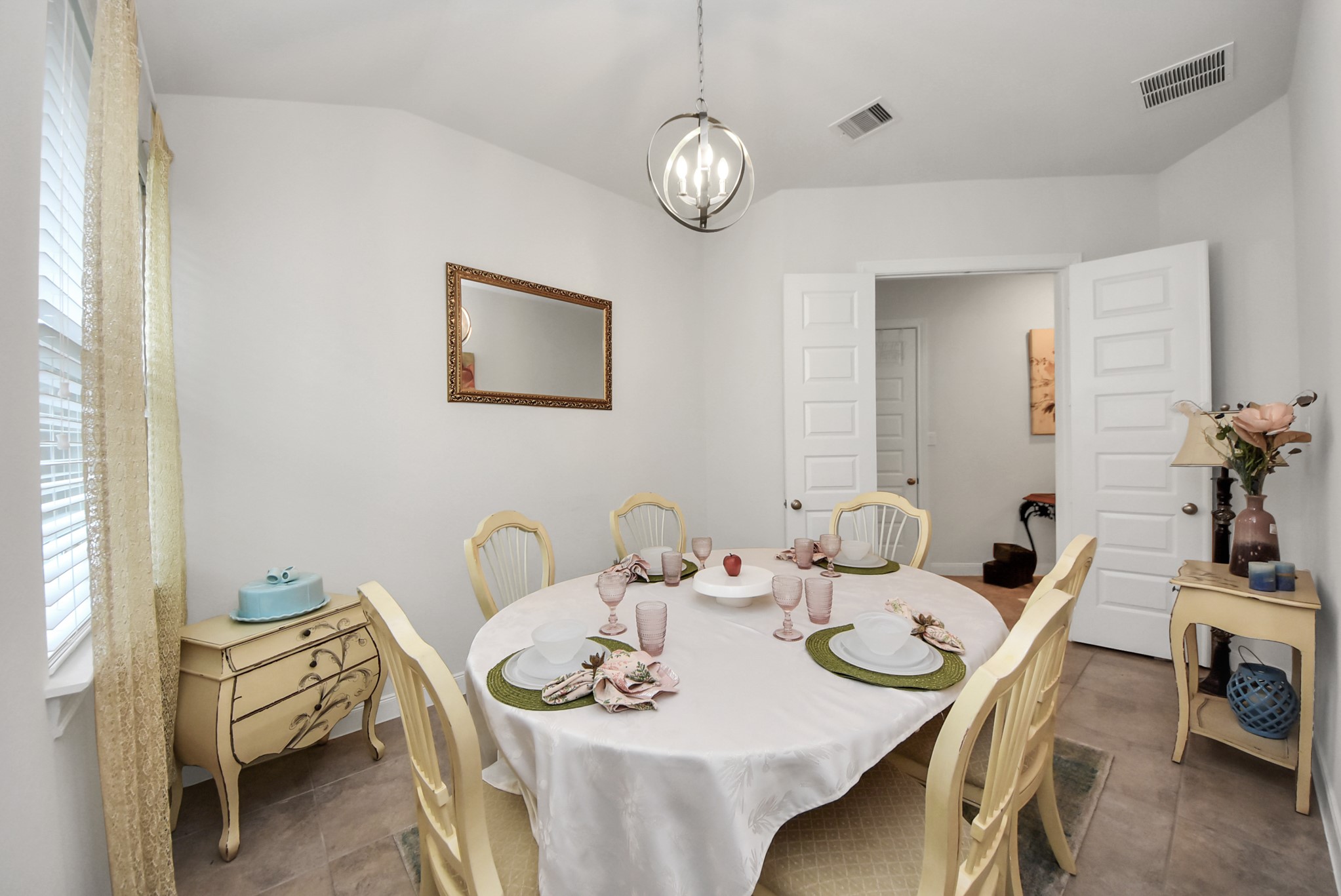 8806 Chapada Highlands Drive Cypress, TX 77433 - Photo 23 of 42 a view of a dining room with furniture and chandelier