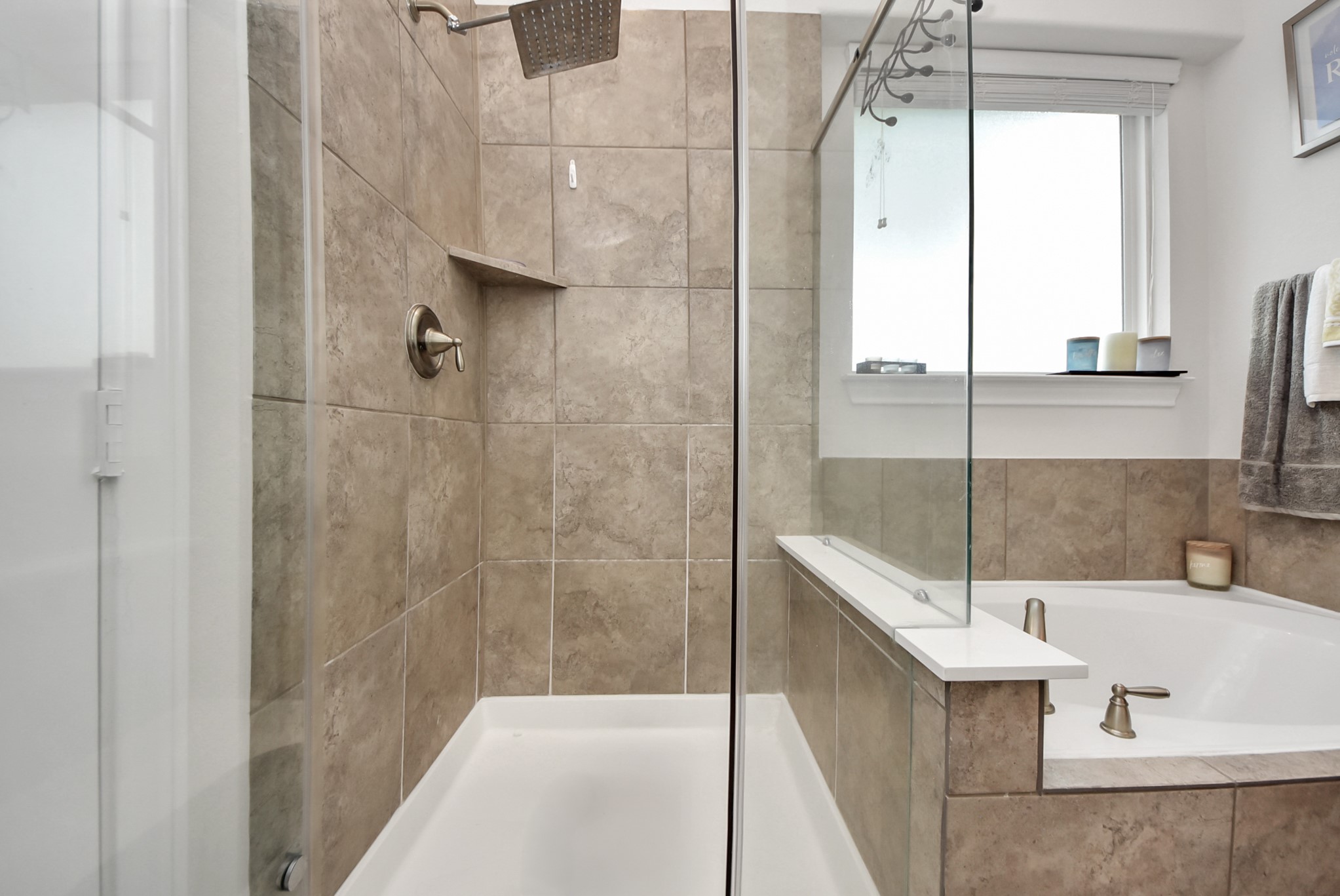 8806 Chapada Highlands Drive Cypress, TX 77433 - Photo 28 of 42 a bathroom with a bathtub and shower