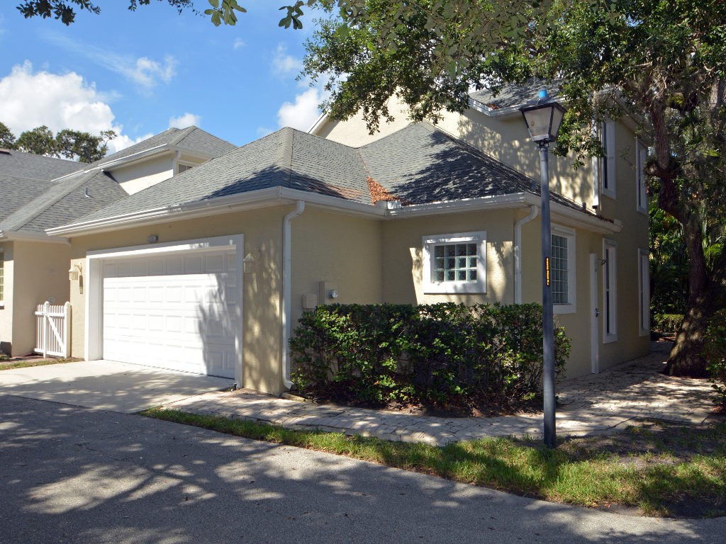 8705 Palm Tree Lane Vero Beach, FL 32963 - Photo 19 of 31 a front view of a house with garden
