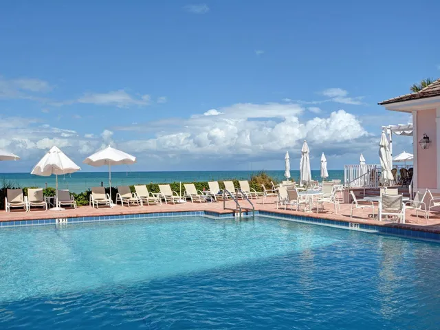 a view of a swimming pool and a yard