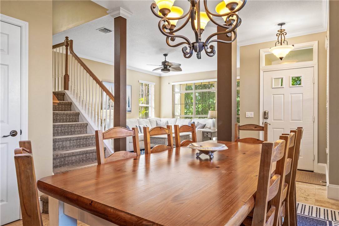 8705 Palm Tree Lane Vero Beach, FL 32963 - Photo 7 of 31 a view of a dining room with furniture window and wooden floor