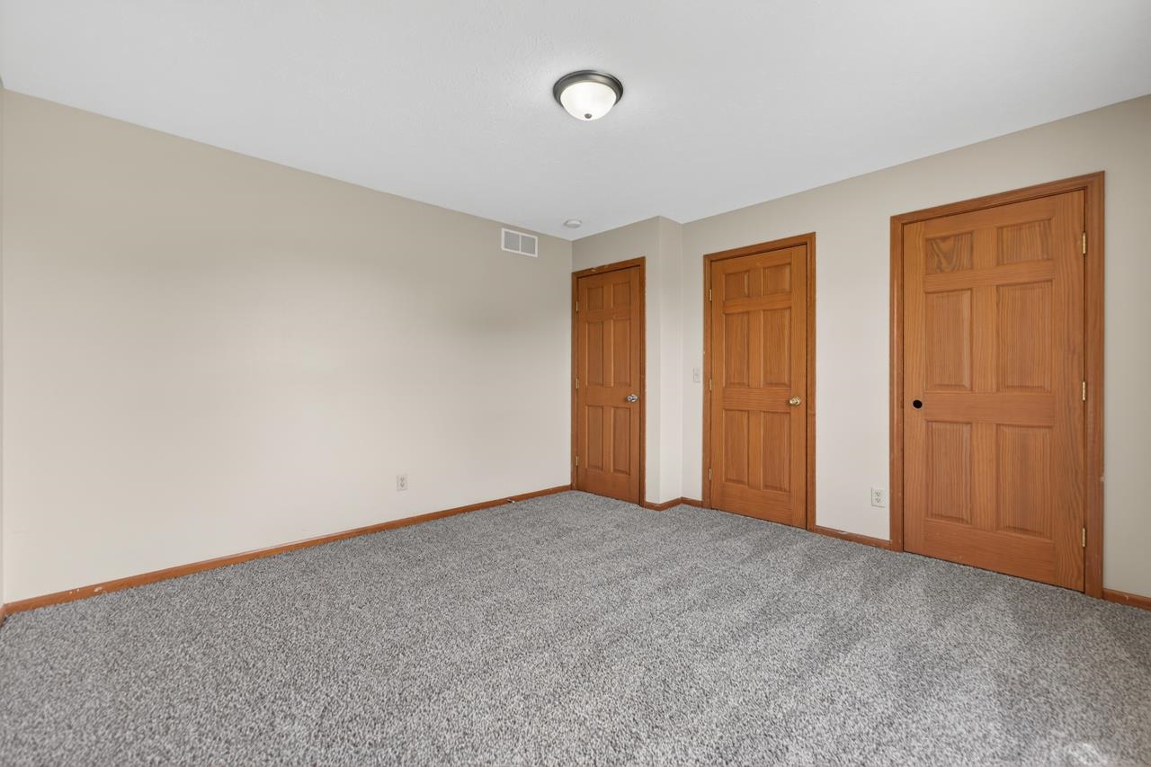 676 Elberon Way Roscoe, IL 61073 - Photo 26 of 30 an empty room with closet area