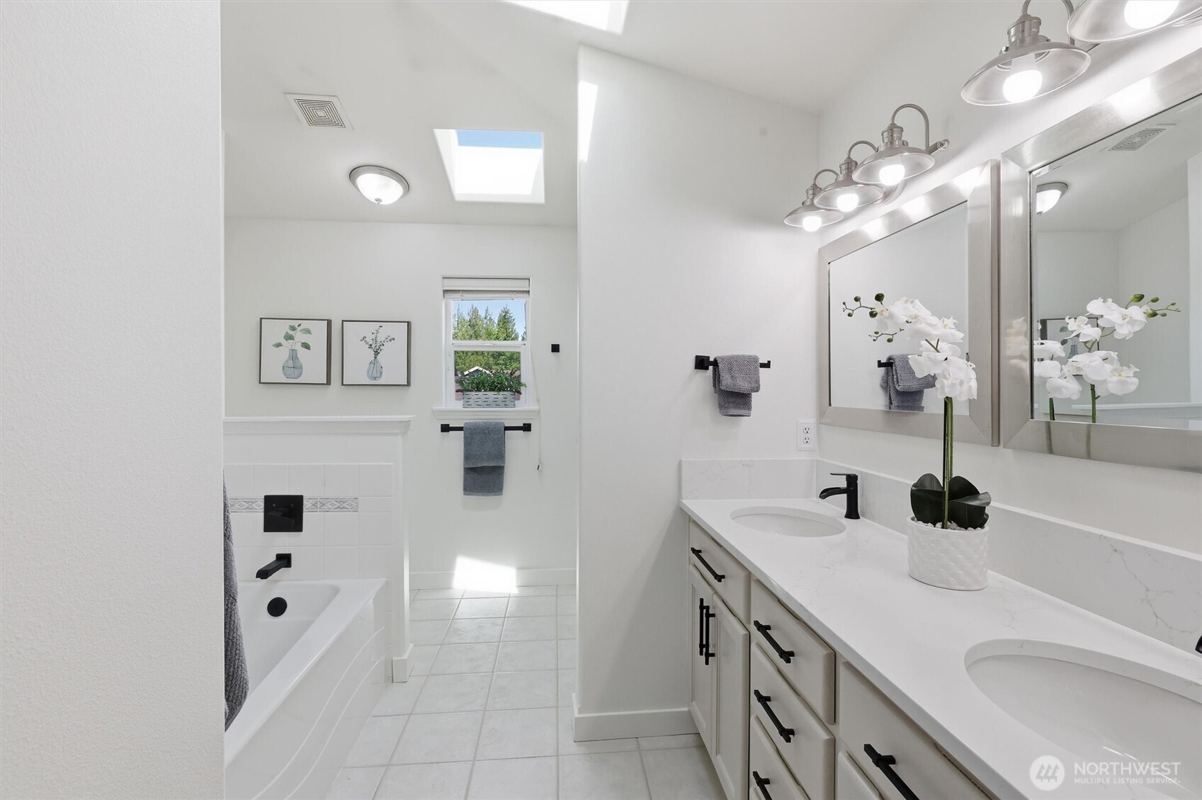 5523 East Wishon Road Snohomish, WA 98290 - Photo 23 of 39 a bathroom with a sink a vanity a mirror and shower