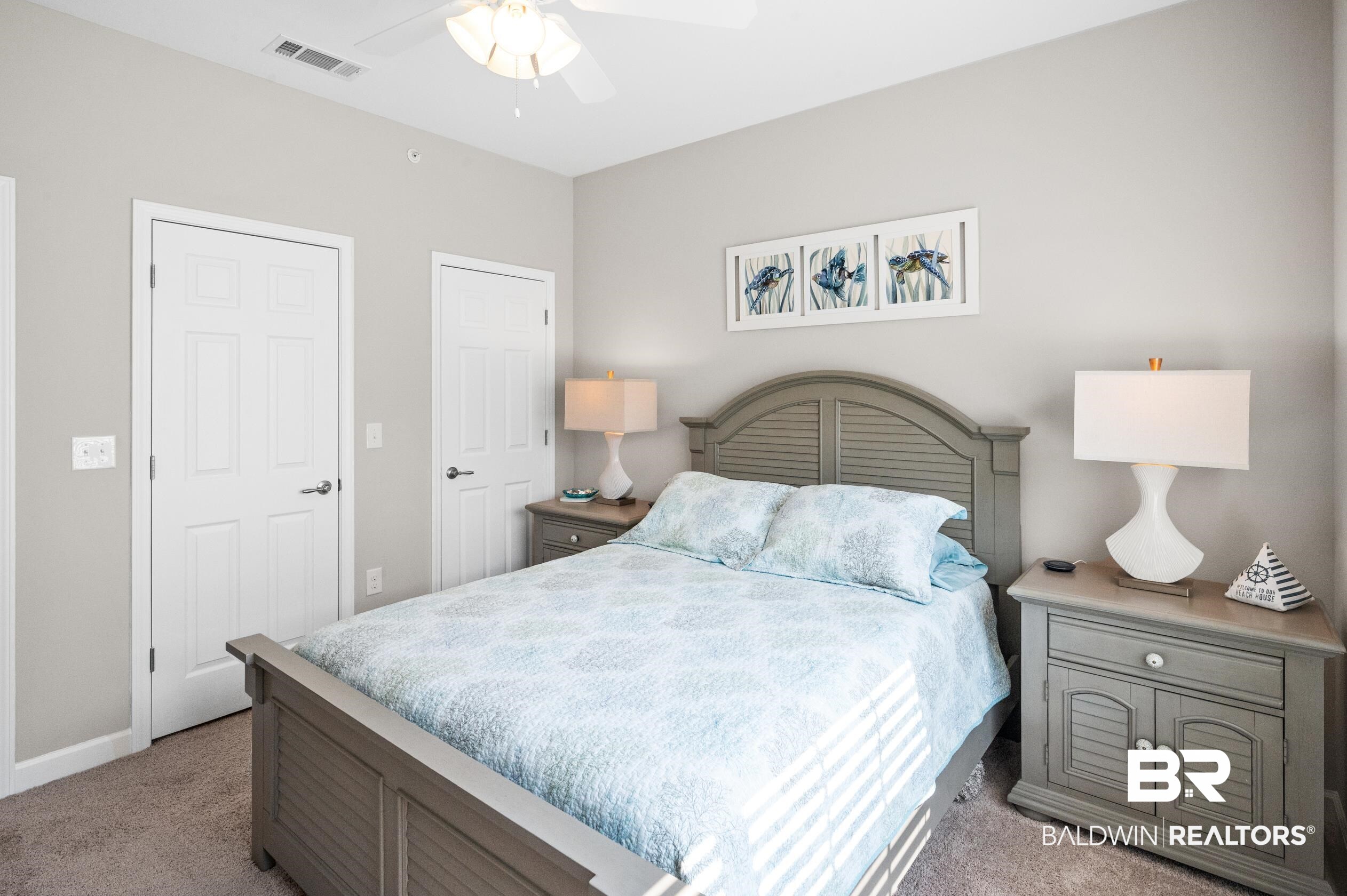430 West Fort Morgan Road, Unit 1902 Gulf Shores, AL 36542 - Photo 34 of 59 Bedroom featuring ceiling fan and carpet flooring
