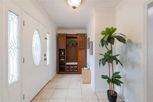 a hallway with potted plants and palm trees