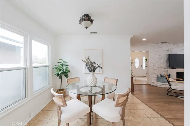 a view of a livingroom with furniture and a potted plant