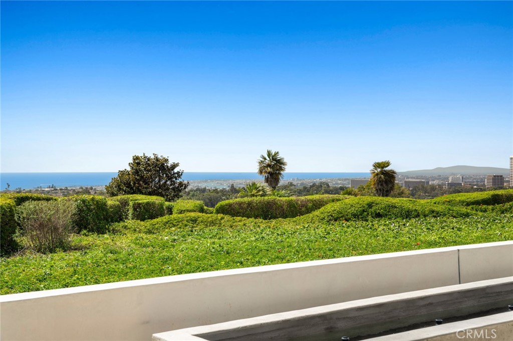 2 Twin Lakes Circle Corona del Mar, CA 92625 - Photo 28 of 31 a view of a garden with a bench and trees in the background