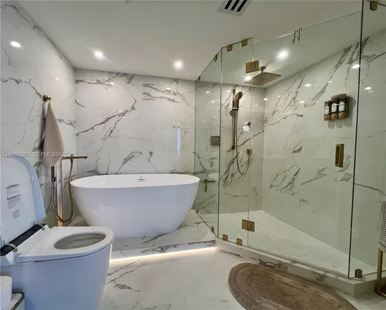 a bathroom with a bathtub and a shower