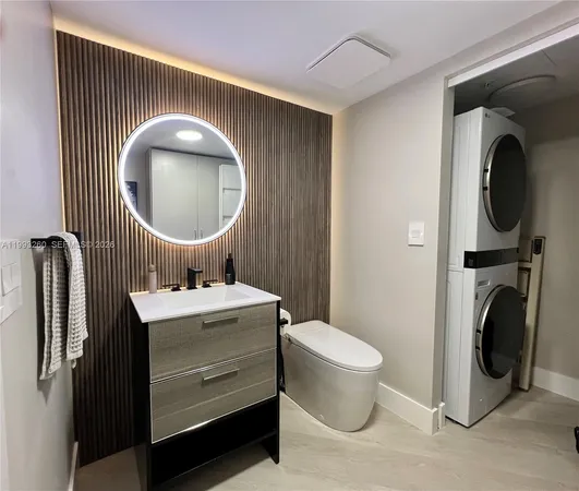 a bathroom with a toilet a sink and a mirror