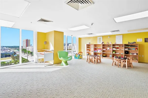 a view of a backyard with plants and outdoor seating