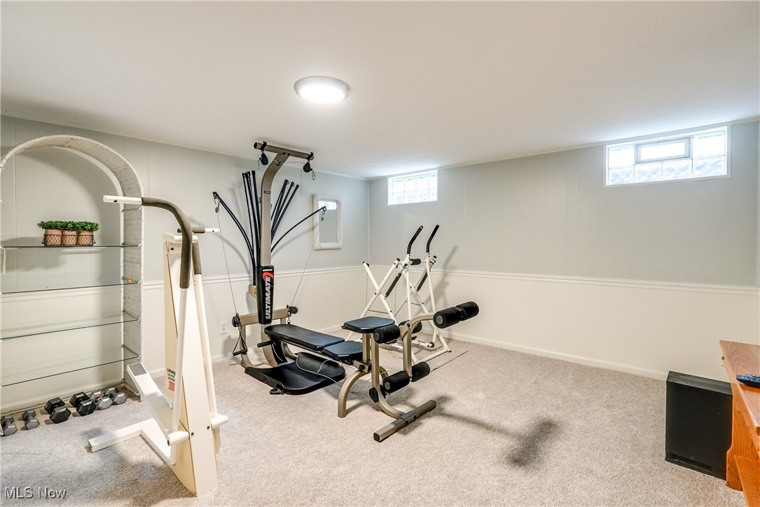 2488 Holgate Road Akron, OH 44313 - Photo 32 of 50 Large workout area with carpet is located in the basement. Great size! Television wall mount remains.