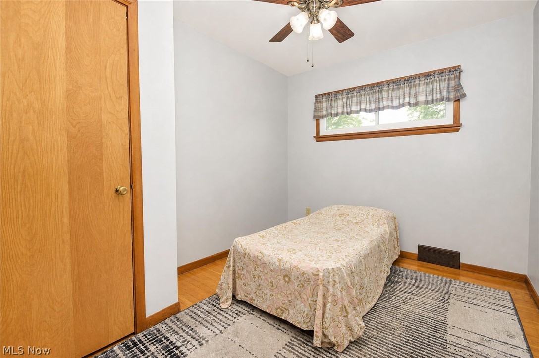 3864 State Road South Ashtabula, OH 44004 - Photo 26 of 50 Wood-finish flooring, light-toned walls, and a wood-framed window