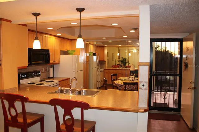 a room with furniture a flat screen tv and a view of the room