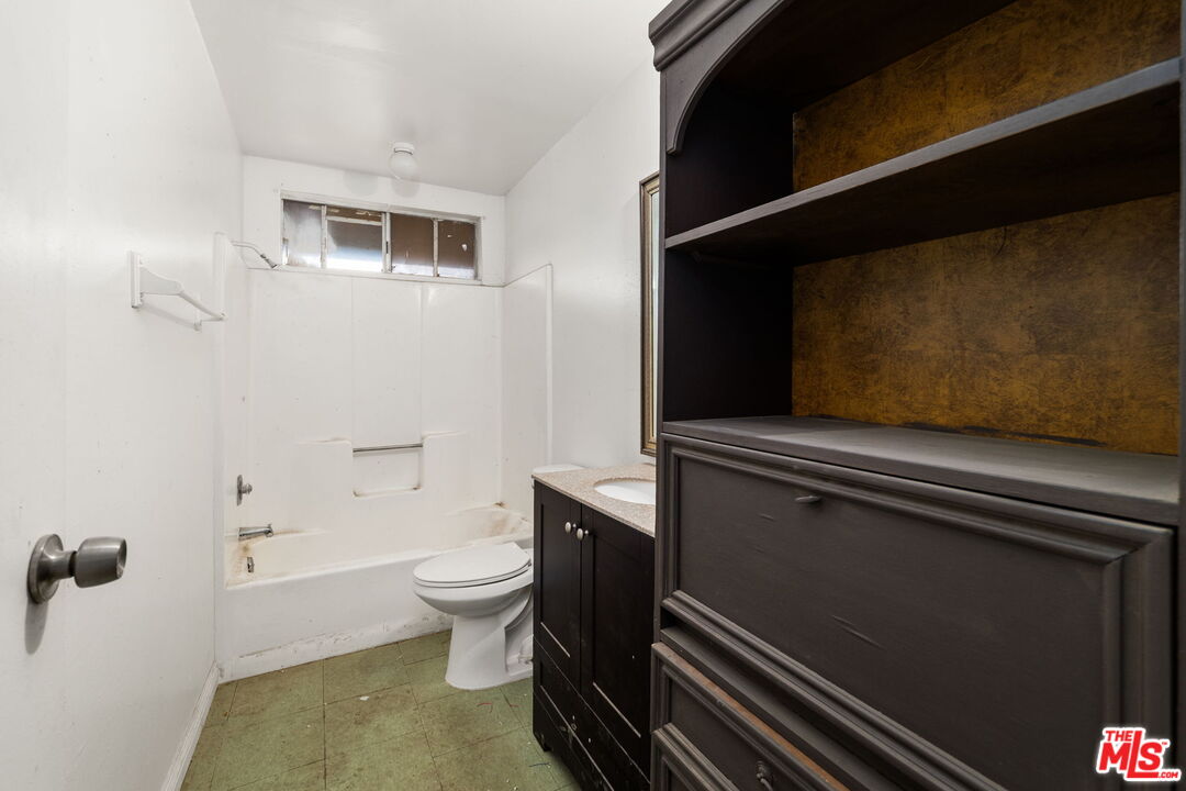 6906 Phelan Road Phelan, CA 92371 - Photo 15 of 42 a bathroom with a toilet and a shower