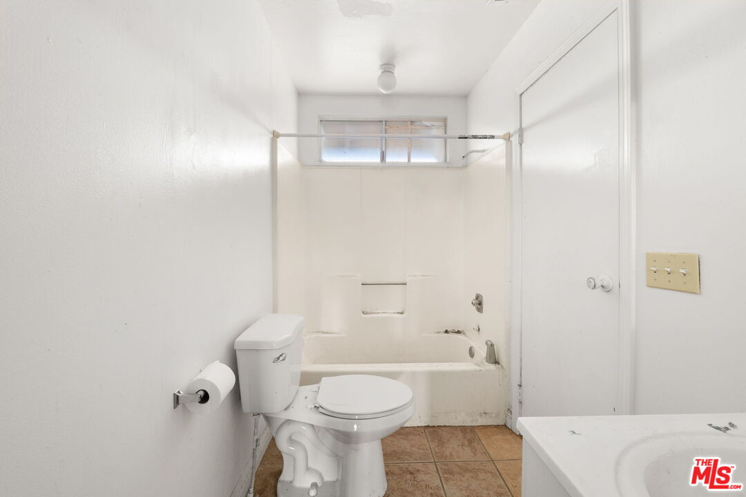 6906 Phelan Road Phelan, CA 92371 - Photo 16 of 42 a bathroom with a sink a toilet and shower