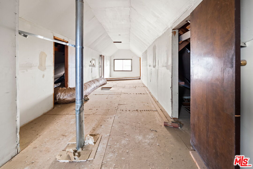 6906 Phelan Road Phelan, CA 92371 - Photo 19 of 42 a view of hallway with wooden floor and chair