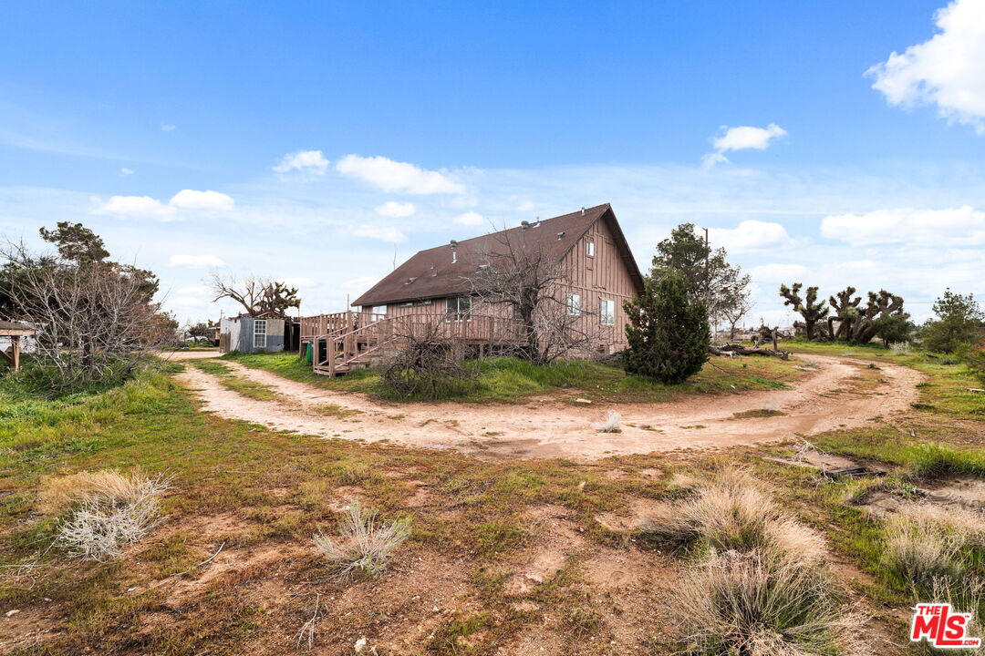 6906 Phelan Road Phelan, CA 92371 - Photo 25 of 42 a view of a house with a yard