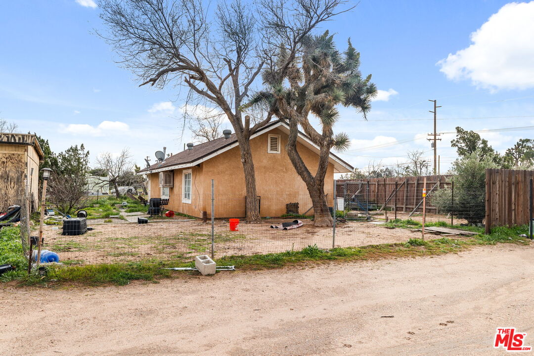 6906 Phelan Road Phelan, CA 92371 - Photo 26 of 42 a backyard of a house with table and chairs