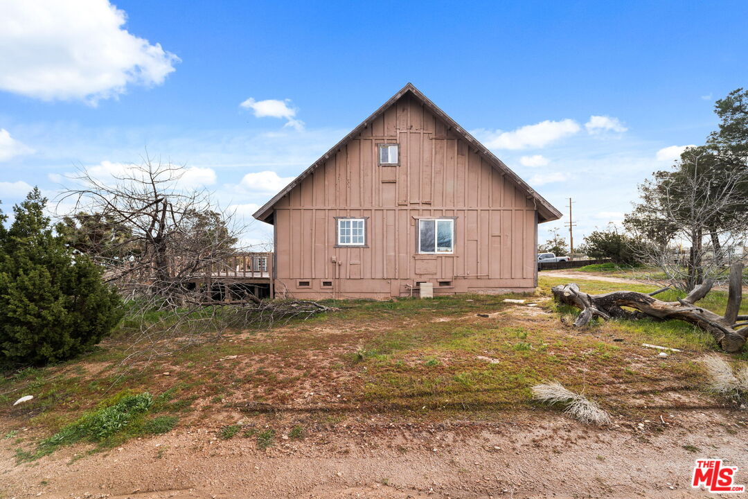 6906 Phelan Road Phelan, CA 92371 - Photo 5 of 42 a view of a house with a yard