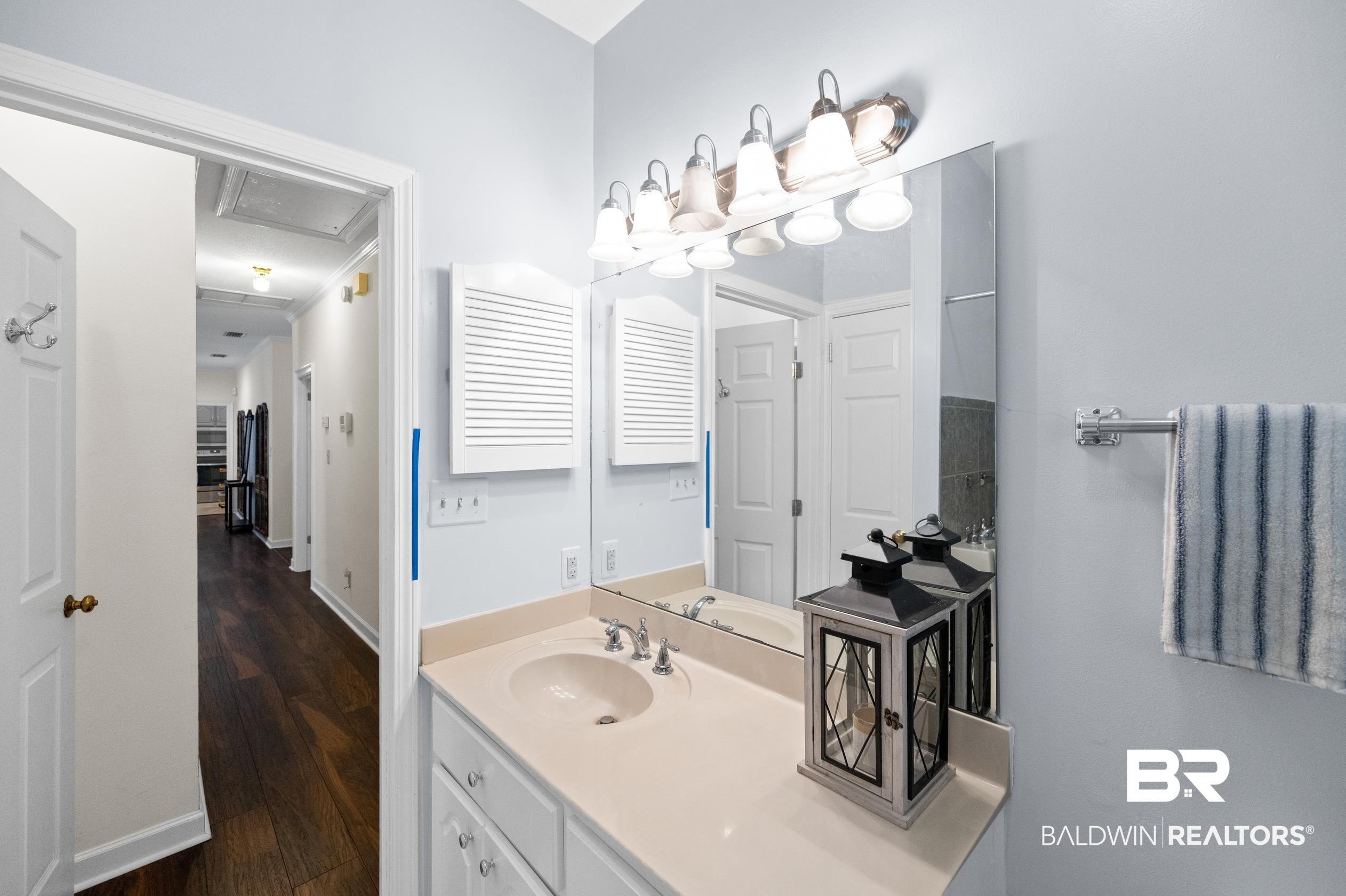 6638 Jackson Square Daphne, AL 36526 - Photo 28 of 62 Bathroom featuring wood-type flooring, vanity, and ornamental molding