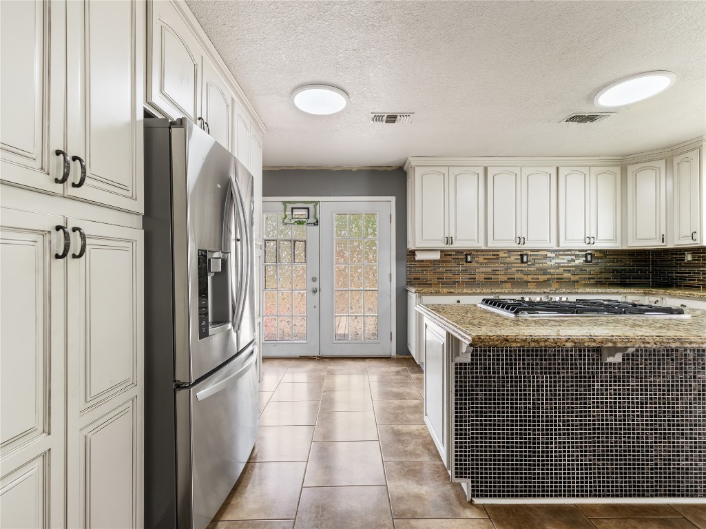 496 James Street Clute, TX 77531 - Photo 13 of 45 a kitchen with stainless steel appliances granite countertop a refrigerator a stove and a sink