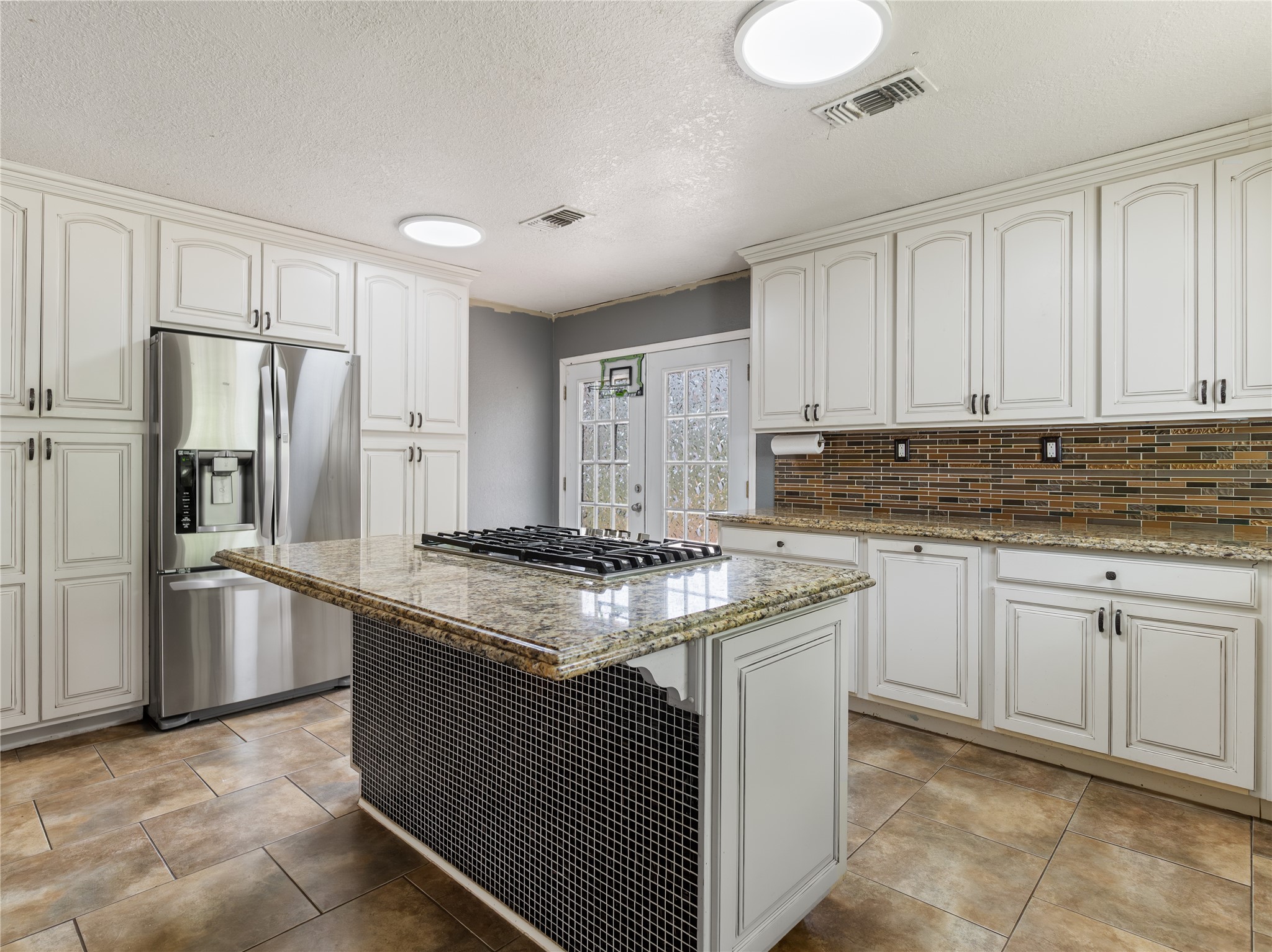 496 James Street Clute, TX 77531 - Photo 14 of 45 a kitchen with stainless steel appliances granite countertop a sink stove and refrigerator