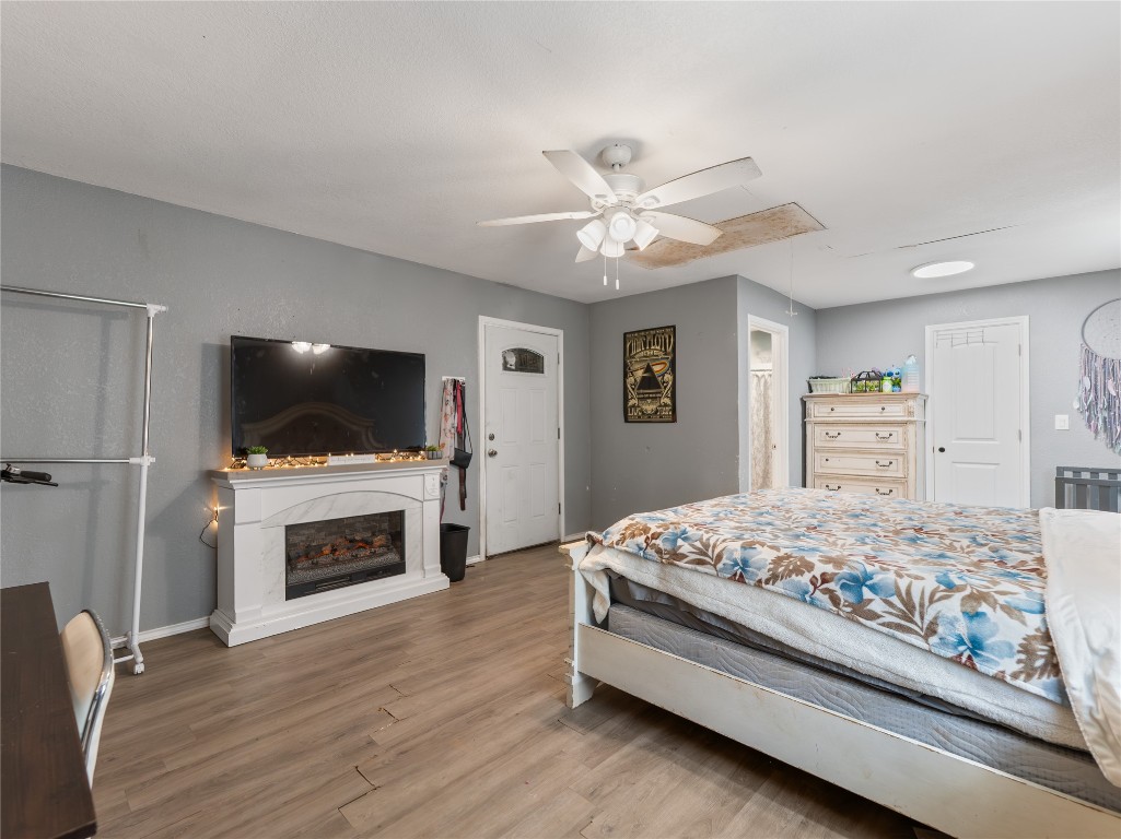 496 James Street Clute, TX 77531 - Photo 18 of 45 a bedroom with a bed and a flat screen tv
