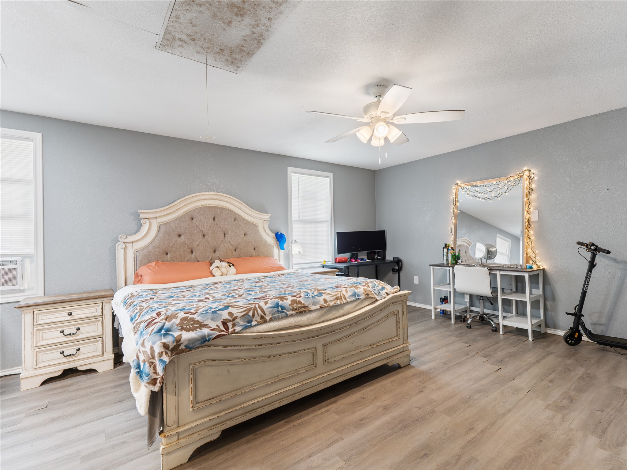 496 James Street Clute, TX 77531 - Photo 19 of 45 a bedroom with a bed and a chandelier