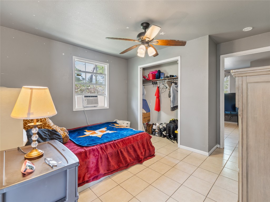 496 James Street Clute, TX 77531 - Photo 26 of 45 a bedroom with a bed and a window