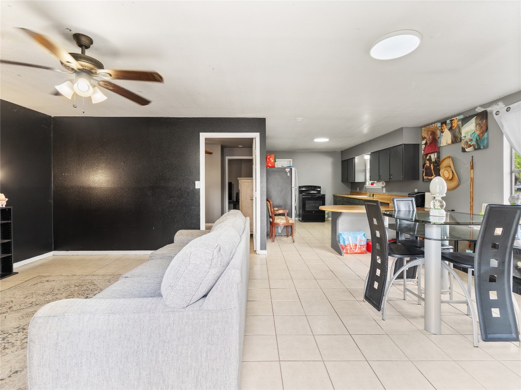 496 James Street Clute, TX 77531 - Photo 30 of 45 a bed room with a bed and a ceiling fan