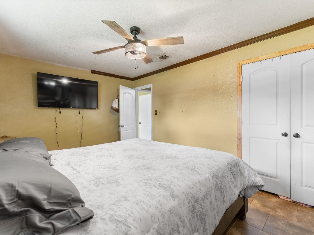 496 James Street Clute, TX 77531 - Photo 31 of 45 a bedroom with a bed and a flat screen tv
