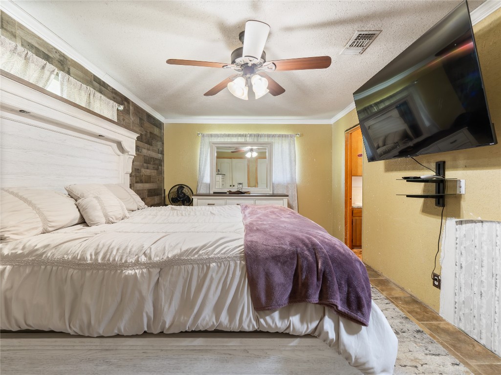 496 James Street Clute, TX 77531 - Photo 39 of 45 a spacious bedroom with a bed and a flat screen tv