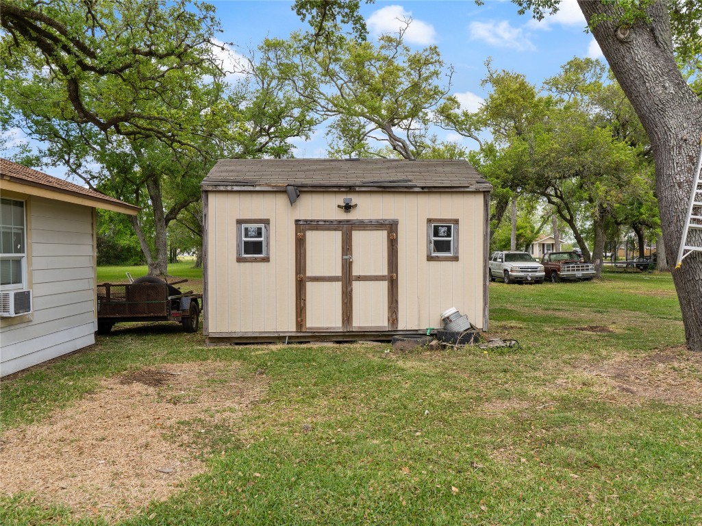 496 James Street Clute, TX 77531 - Photo 41 of 45 a white house that has a tree in front of it