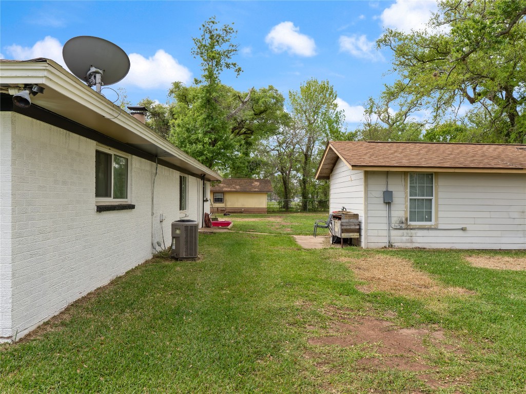 496 James Street Clute, TX 77531 - Photo 42 of 45 a front view of a house with garden