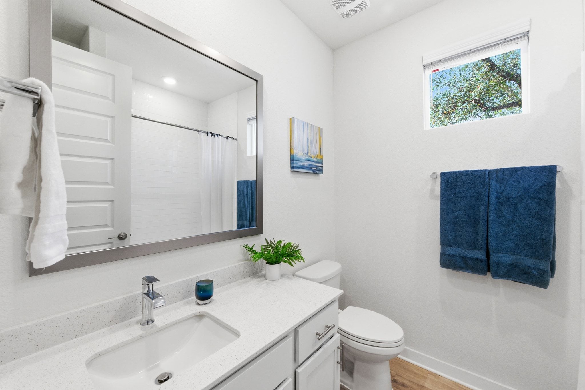 4420 Ingram Road Georgetown, TX 78628 - Photo 23 of 40 Bathroom with vanity, curtained shower, and light wood-style flooring
