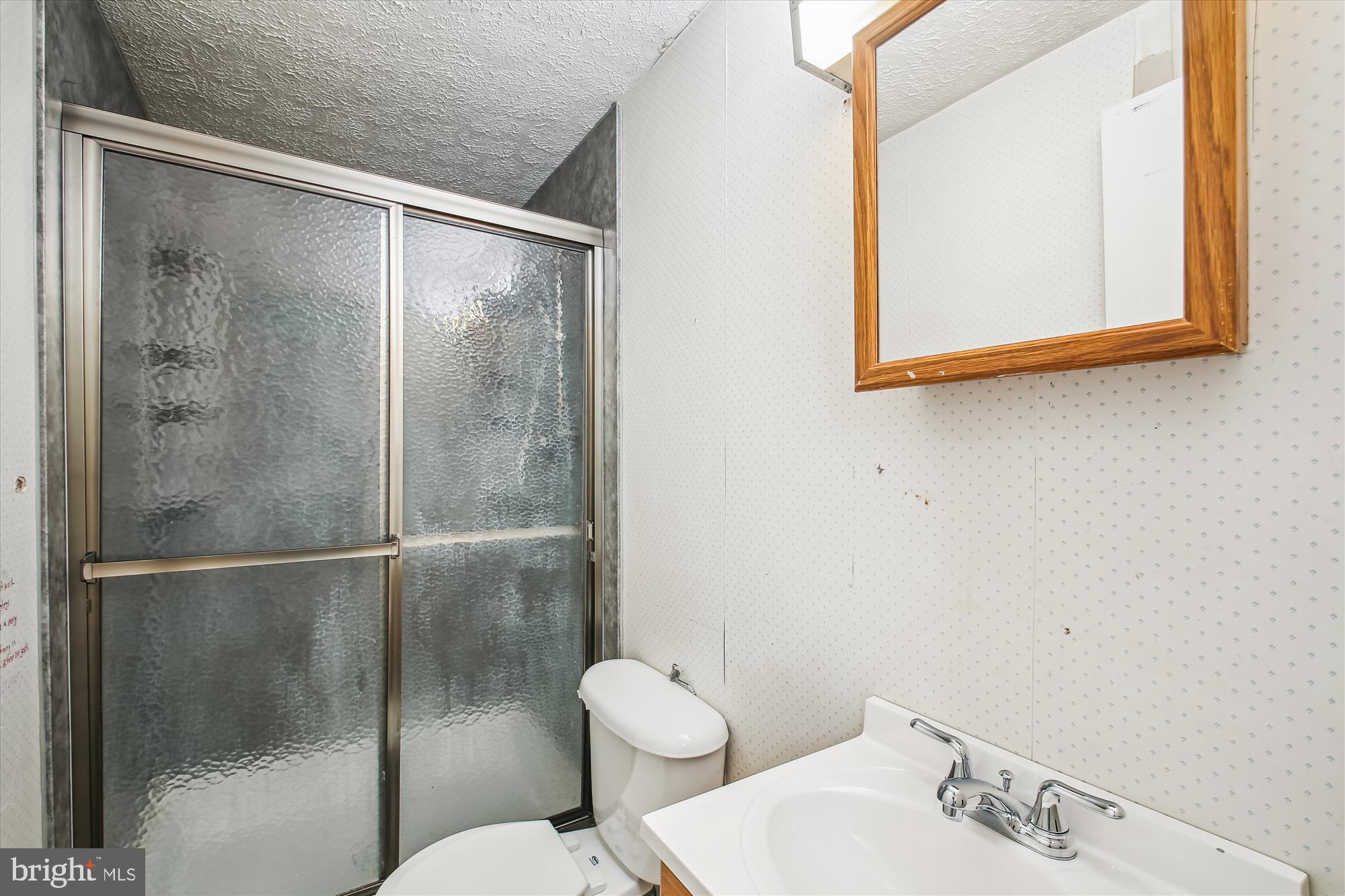 6424 St Phillips Road Linthicum Heights, MD 21090 - Photo 13 of 29 a bathroom with a granite countertop sink mirror and toilet