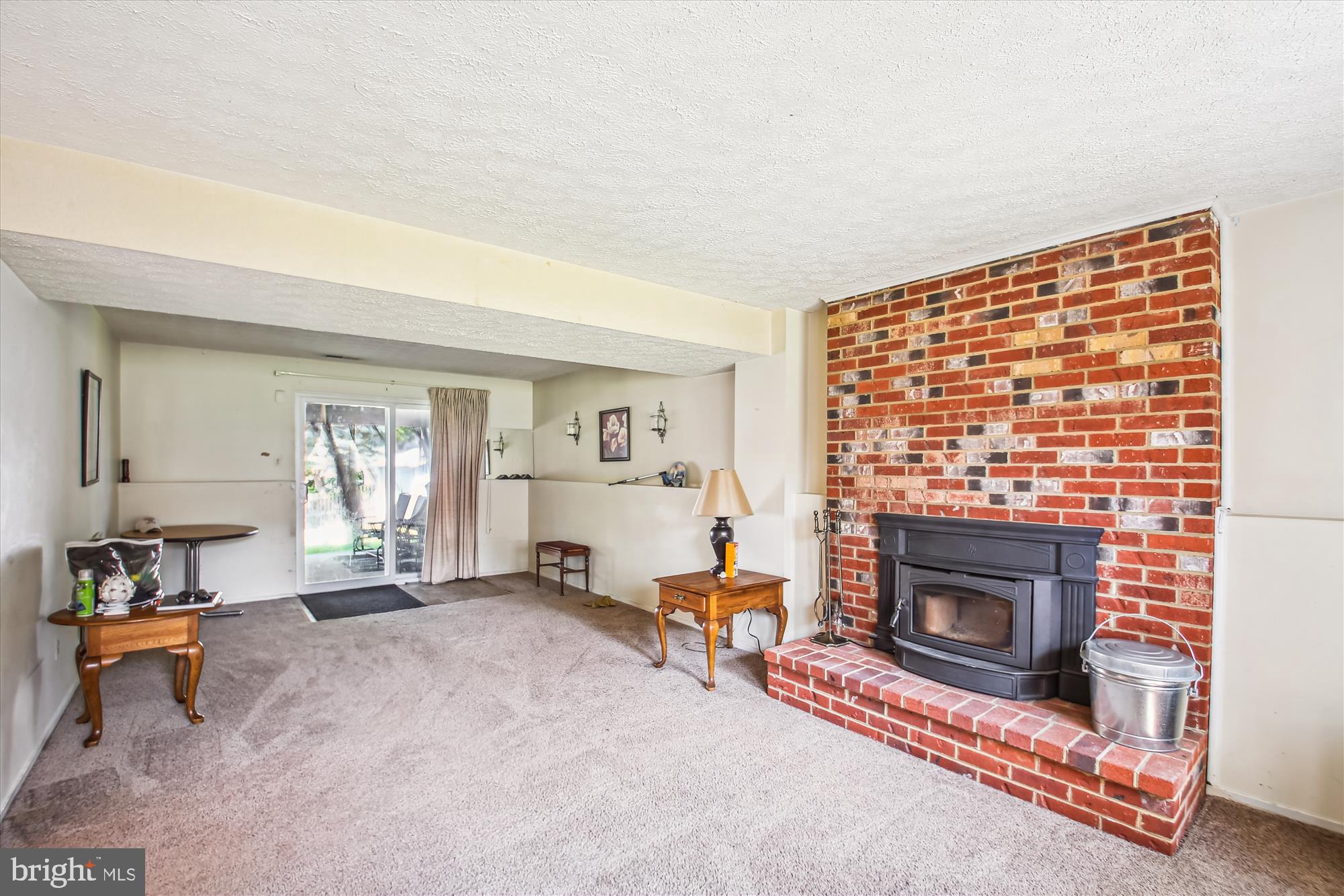 6424 St Phillips Road Linthicum Heights, MD 21090 - Photo 18 of 29 a living room with furniture and a fireplace