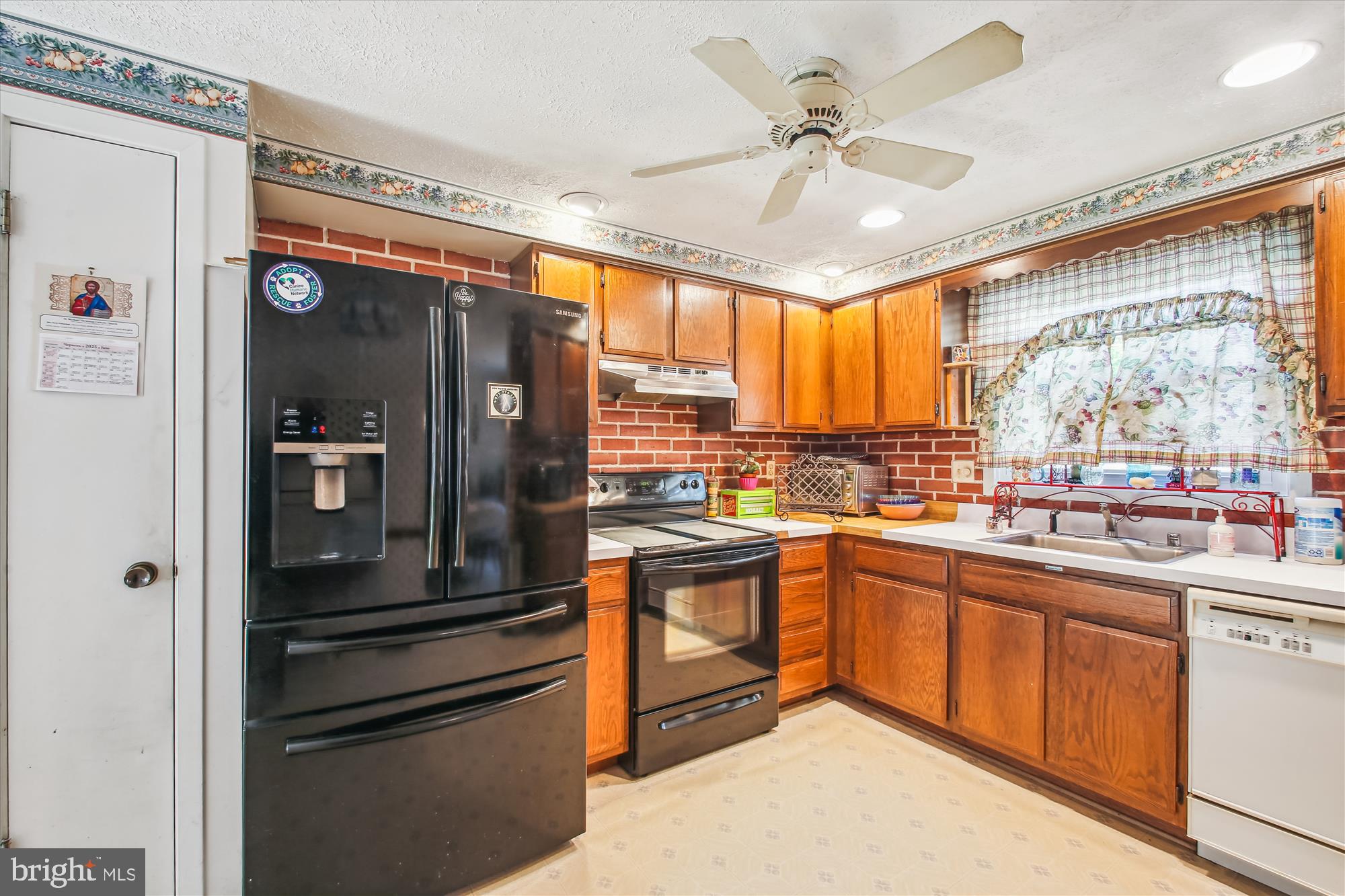 6424 St Phillips Road Linthicum Heights, MD 21090 - Photo 8 of 29 a kitchen with stainless steel appliances granite countertop a refrigerator and a sink