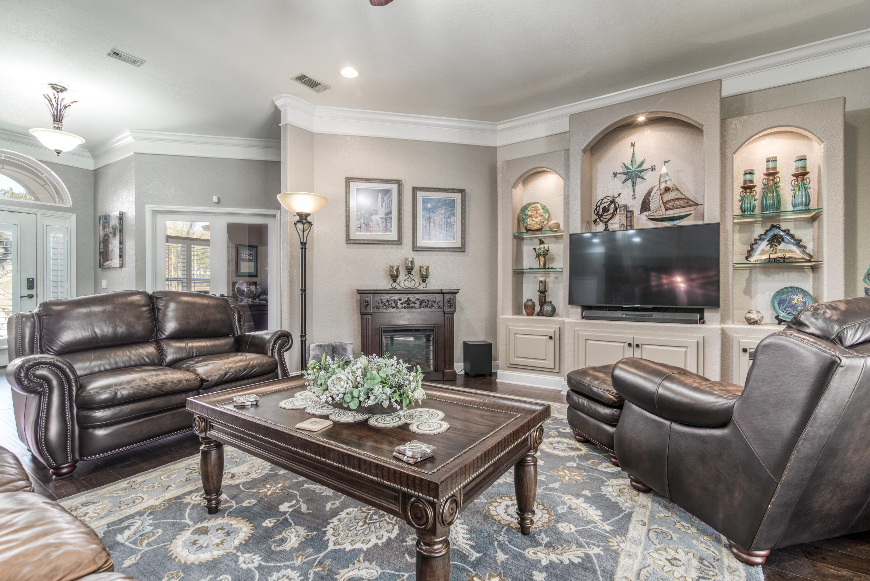 4563 Pfitzer Circle Crestview, FL 32536 - Photo 14 of 79 a living room with furniture a large window and a flat screen tv